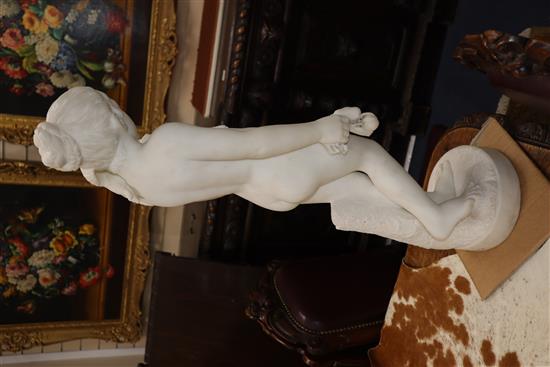 A marble figure of a nude female, a bird on her shoulder, signed Bouzadou (?), height 75cm